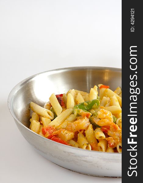 Shrimp Penne Pasta cooked in a stainless steel frying pan. Shrimp Penne Pasta cooked in a stainless steel frying pan