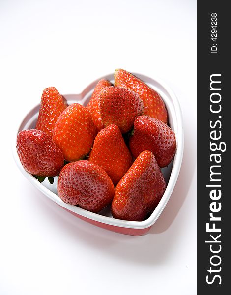 Strawberry in plastic box heart shape