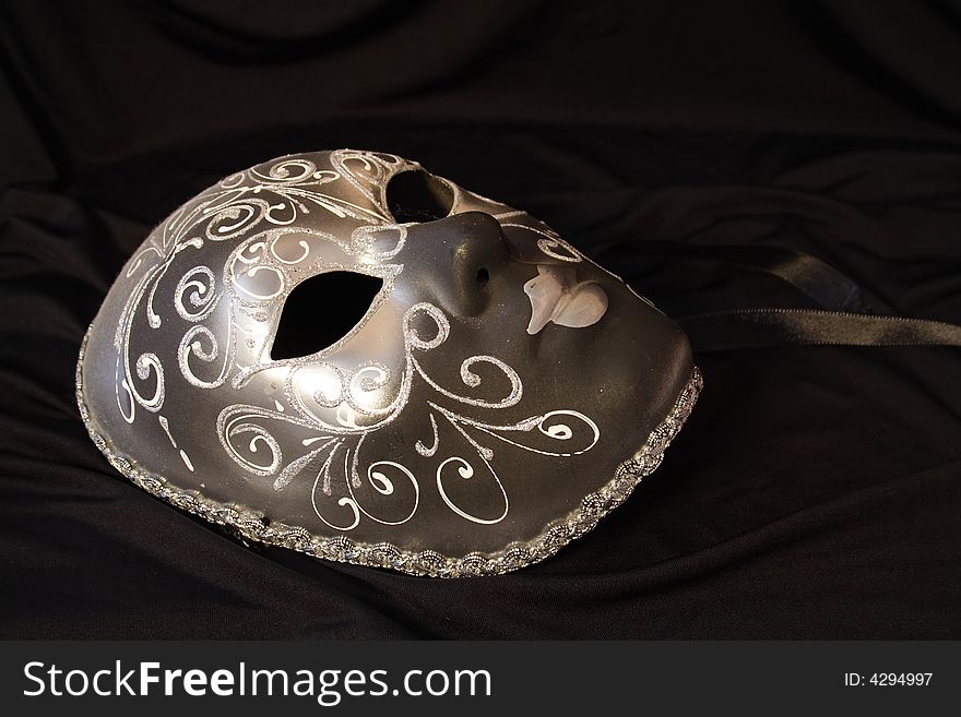 Handmade carnival venetian mask isolated over black background