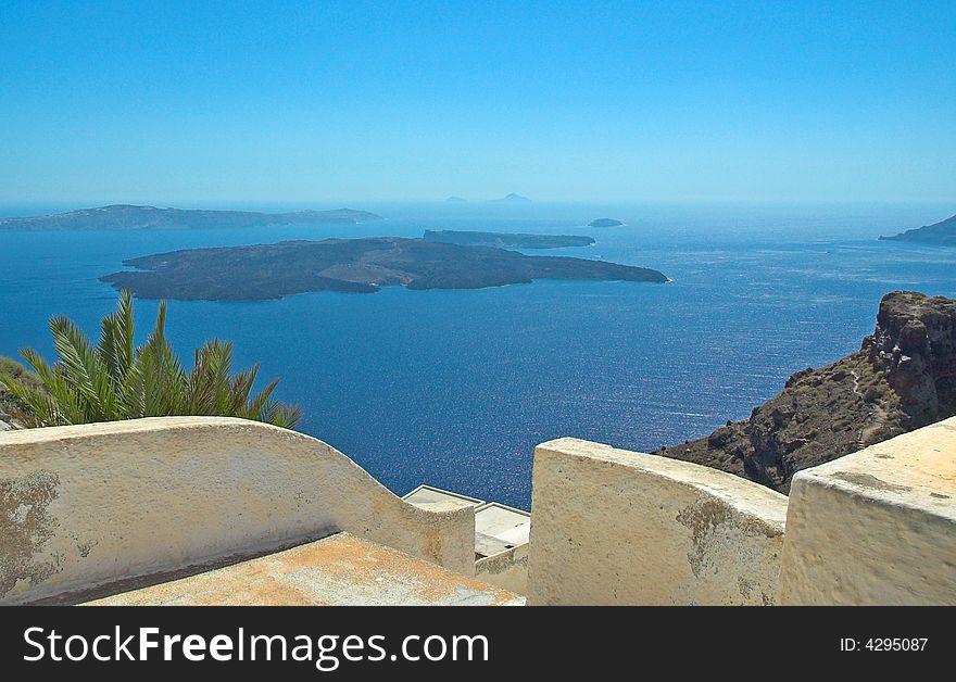 Overlooking the Aegean sea from a clifftop in Santorini. Overlooking the Aegean sea from a clifftop in Santorini