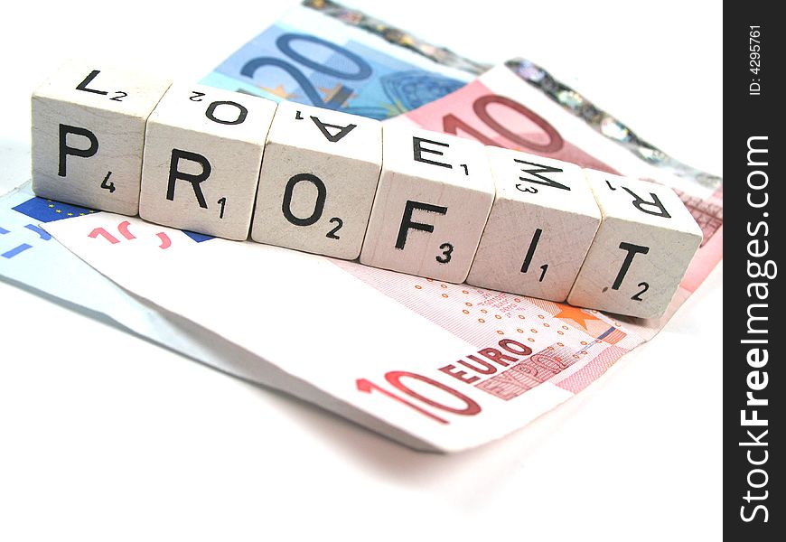 Some Euro banknotes and the word profit