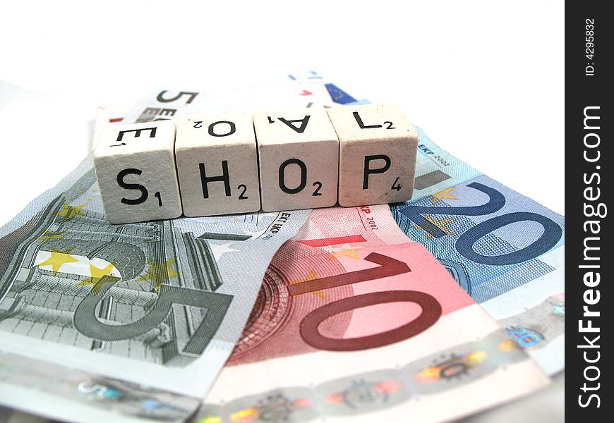 Several euro banknotes with the word shop