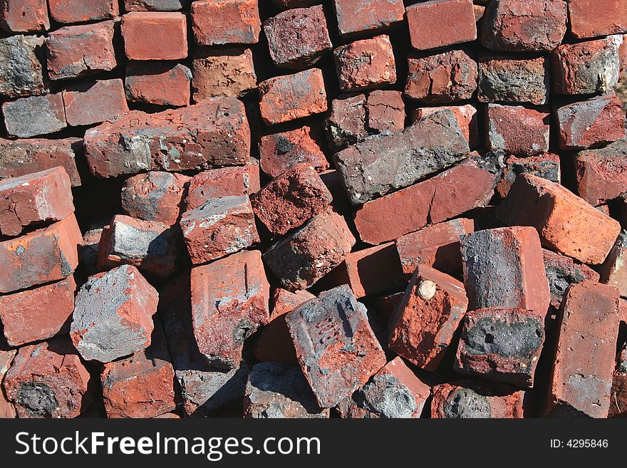 Old red brick pile background