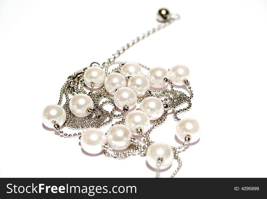 Pearl necklace on the white isolated background