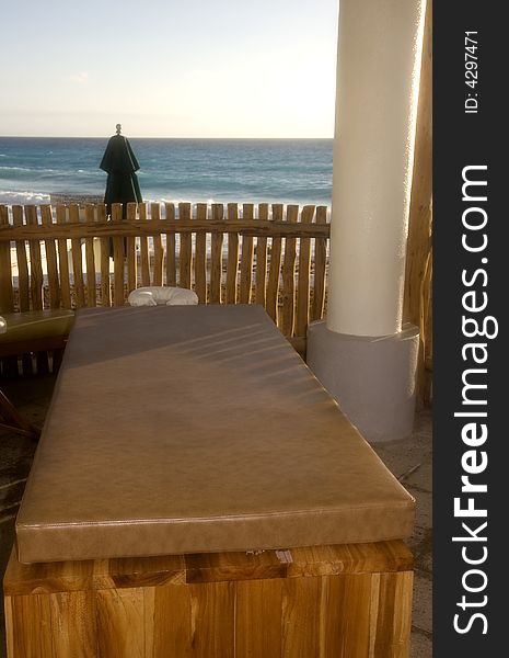 A massage table in a straw hut at the beach. A massage table in a straw hut at the beach