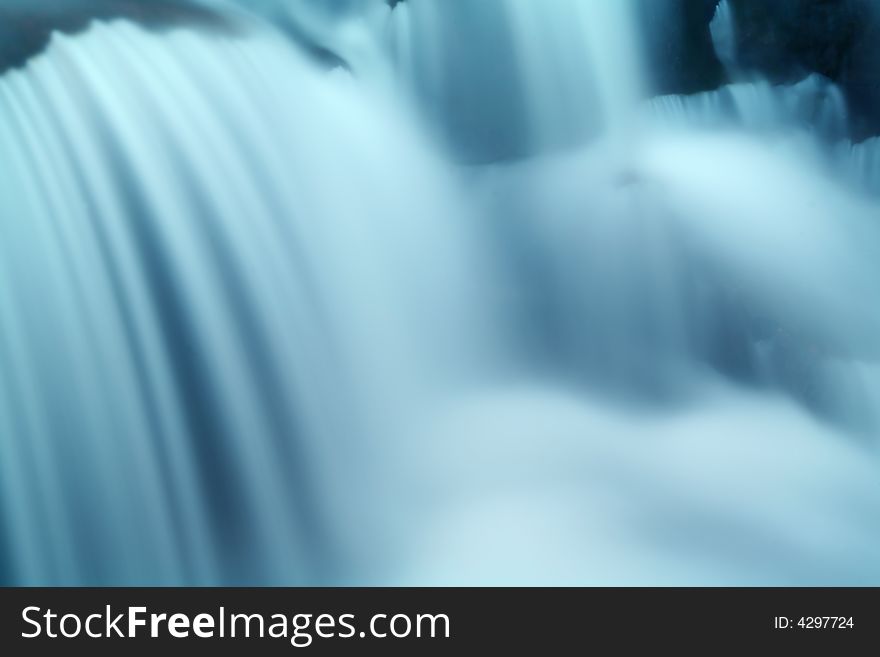 Long exposure of a mountain stream falling over rocks. Long exposure of a mountain stream falling over rocks