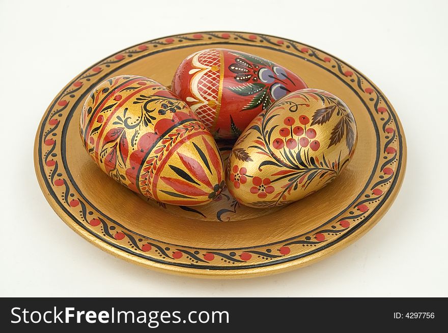 Colour wooden dish with figure. Colour easter eggs.