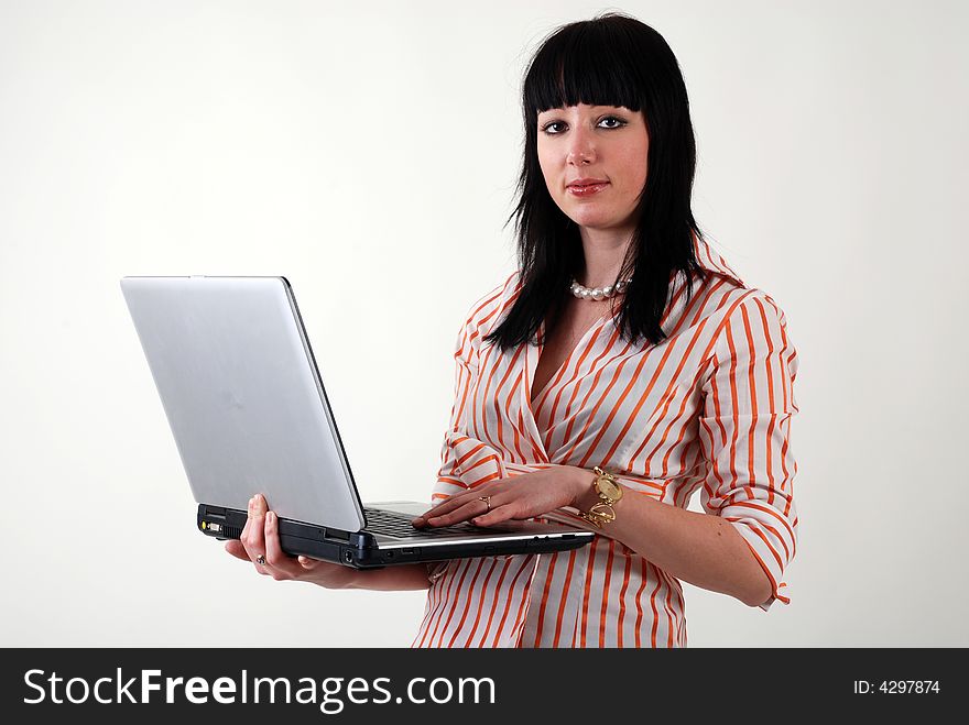 Young beautiful professional women with laptop in the hands