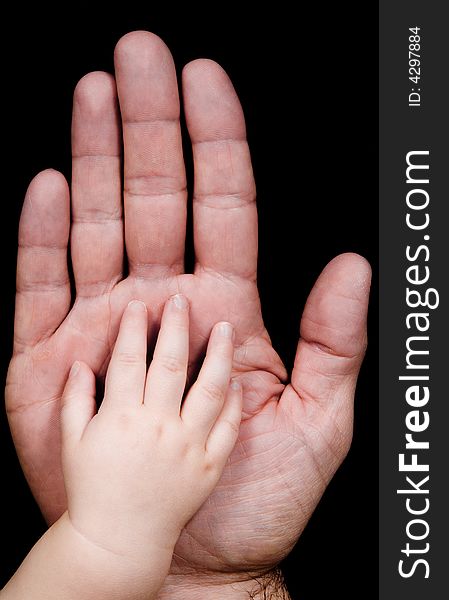 Two hands with father and his baby son. Two hands with father and his baby son