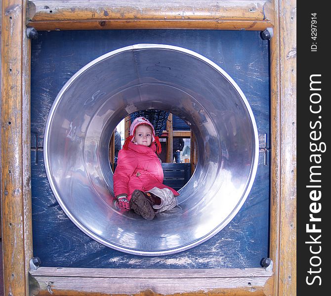 Little girl playing in playground