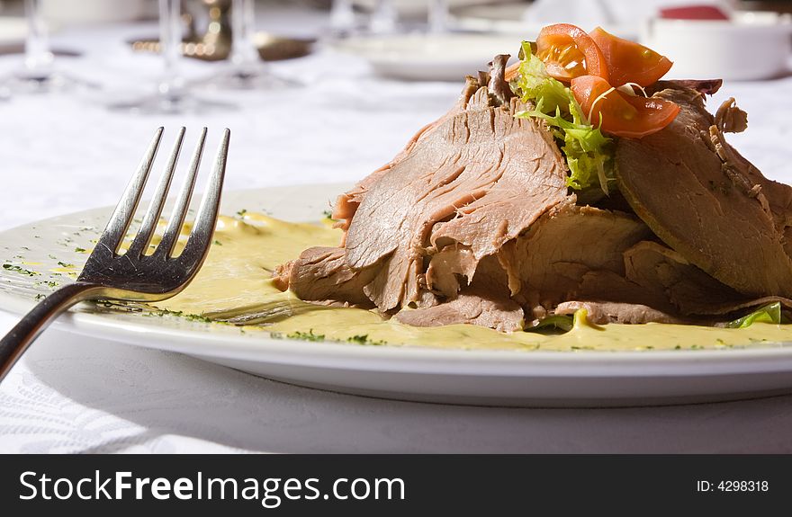 Beef Meat With Tomatoes And Greens On A Plate