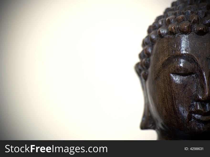 The face of a buddha wood statue