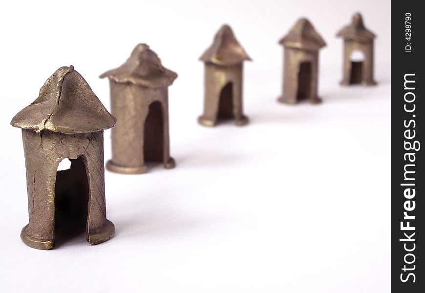 African statues of cottages made of brass. African statues of cottages made of brass