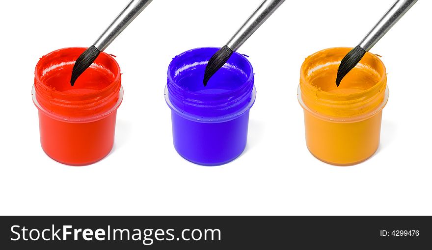 Paintbrushes and paints, isolated on white background