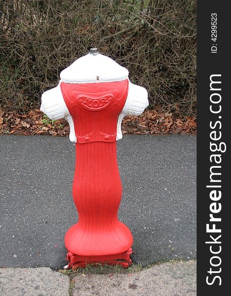 Funny fire hydrant painted red and white. Funny fire hydrant painted red and white