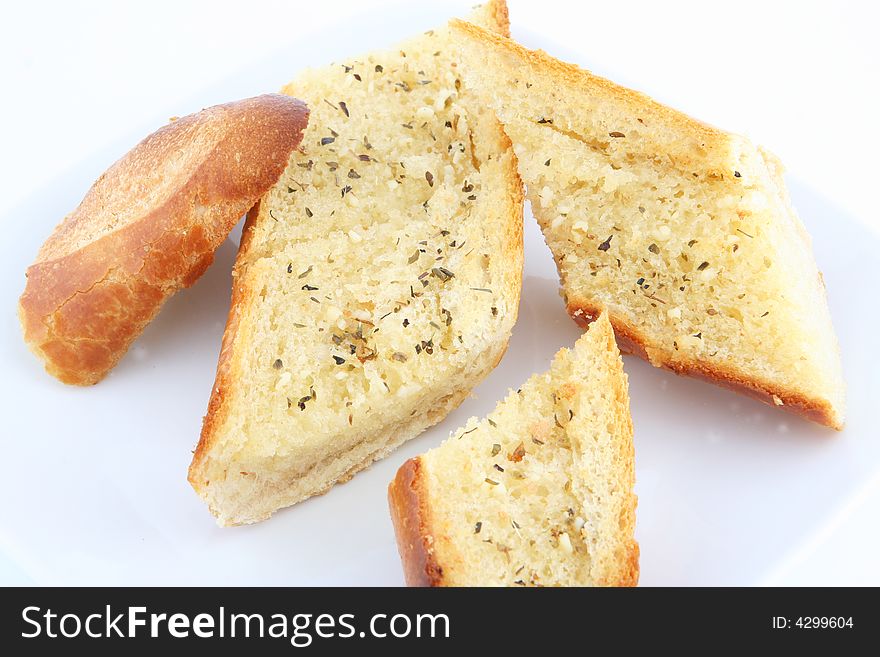 Oven baked garlic bread in plate. Oven baked garlic bread in plate