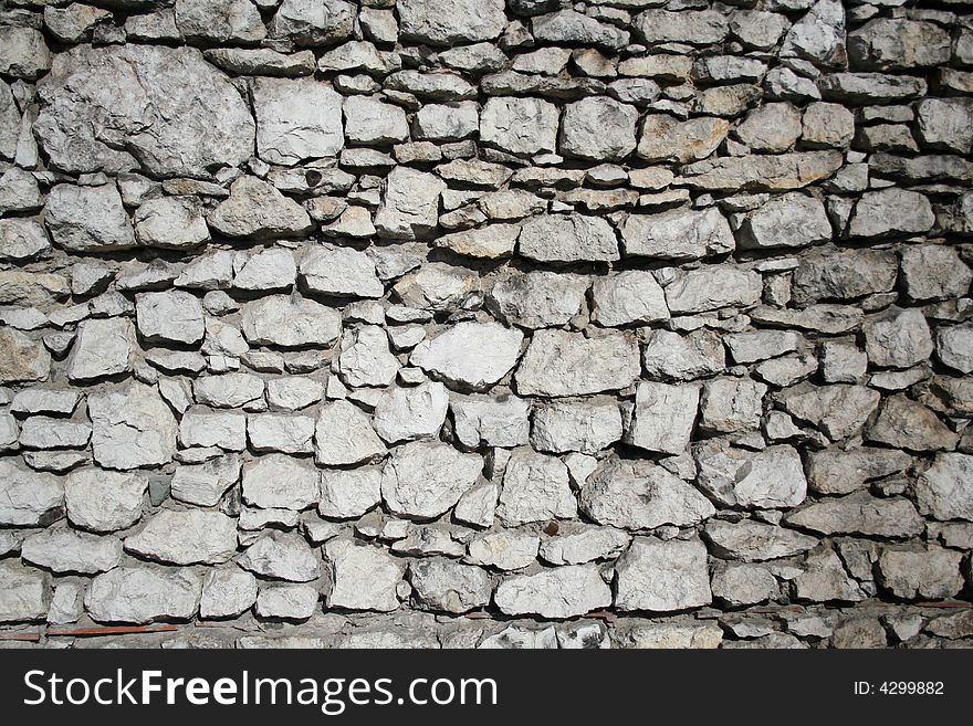 Gray Wall from the stones. Background, texture