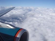 Airplane Engine Above Clouds Royalty Free Stock Photos
