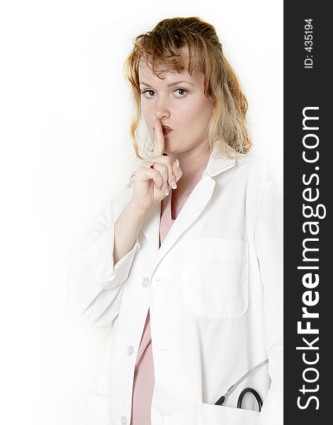 Lady doctor with finger in front of lips