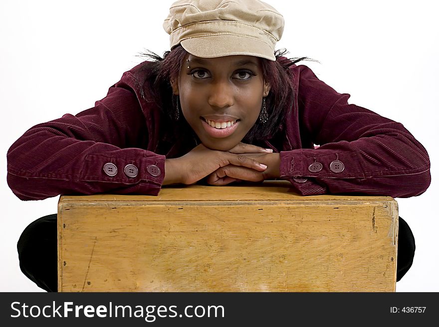 Young Black Woman Leaning On A Box With Room For Copy Space
