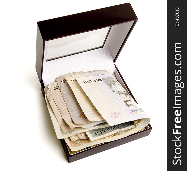 Some currency bills in a wooden box. Clipping path. Some currency bills in a wooden box. Clipping path