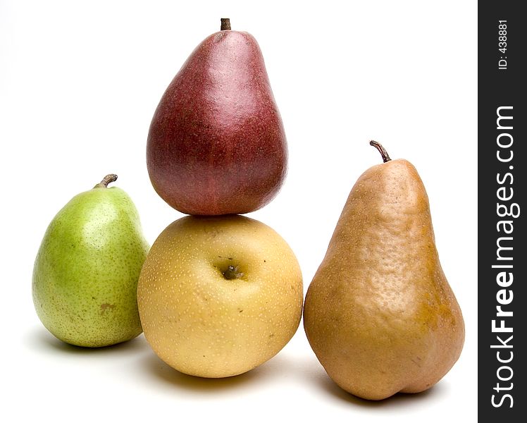 Four different sorts of pears together, isolated against white background. Four different sorts of pears together, isolated against white background.