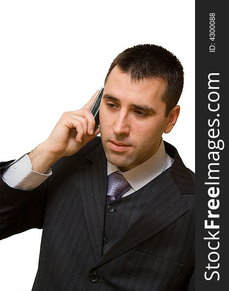 A man, talking over the cellular phone, looking a little bit disappointed. A man, talking over the cellular phone, looking a little bit disappointed