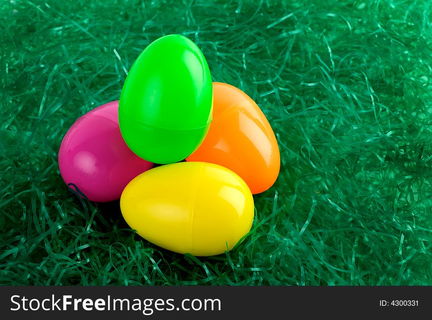 Colorful Easter eggs on green straw