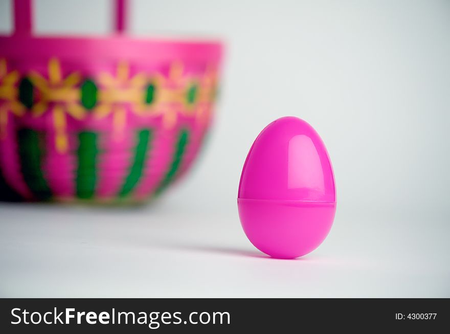 Easter egg and basket on white background