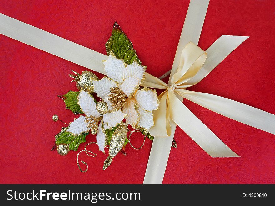 Red present paper with gold bow and flowers. Red present paper with gold bow and flowers