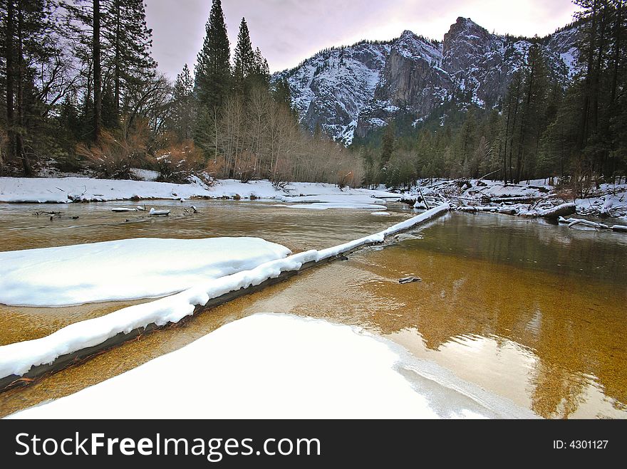 This is the snow capped three brothers in Yosemite and merced river. This is the snow capped three brothers in Yosemite and merced river