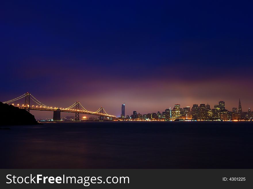 Sun rises in downtown San Francisco.  This photograph was taken from Treasure Island. Sun rises in downtown San Francisco.  This photograph was taken from Treasure Island.