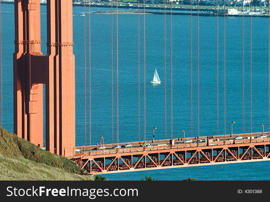 Sail boat in the pacific ocean in San Francisco bay framed by the golden gate bridge. Sail boat in the pacific ocean in San Francisco bay framed by the golden gate bridge.