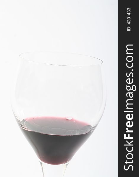 Red wine in a glas,on awithe background,.