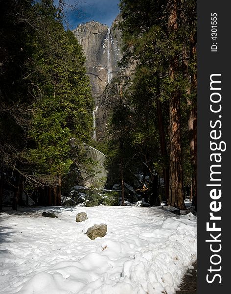 This is the lower yosemite falls with snow, in Yosemite National Park.