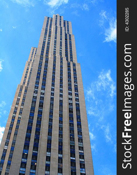 Image of skyscraper with bright blue sky. Image of skyscraper with bright blue sky