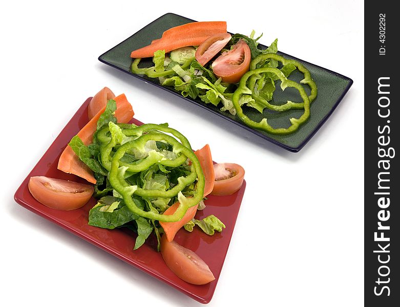 Couple of garden salads isolated on a white background. Couple of garden salads isolated on a white background.