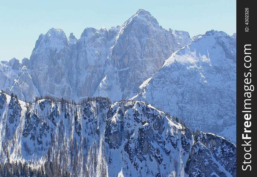 Beautiful snowy alpine peaks in winter. Beautiful snowy alpine peaks in winter