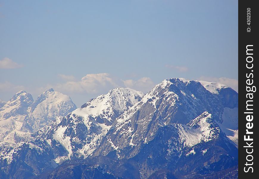 Beautiful snowy alpine peaks in winter. Beautiful snowy alpine peaks in winter