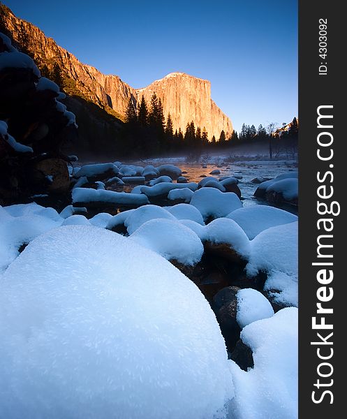 El Capitan and frozen merced river at sunset, Yosemite National Park. El Capitan and frozen merced river at sunset, Yosemite National Park.