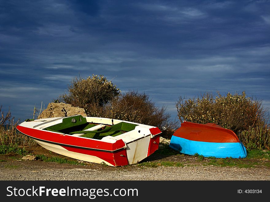 An image of two boats in a stormy weather. An image of two boats in a stormy weather