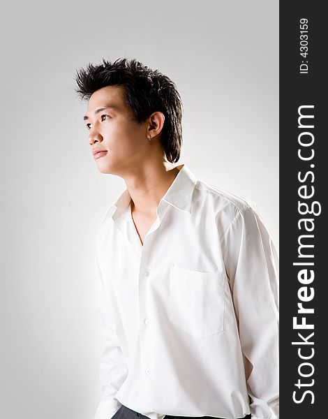 Young man look up thinking with white shirt. Young man look up thinking with white shirt