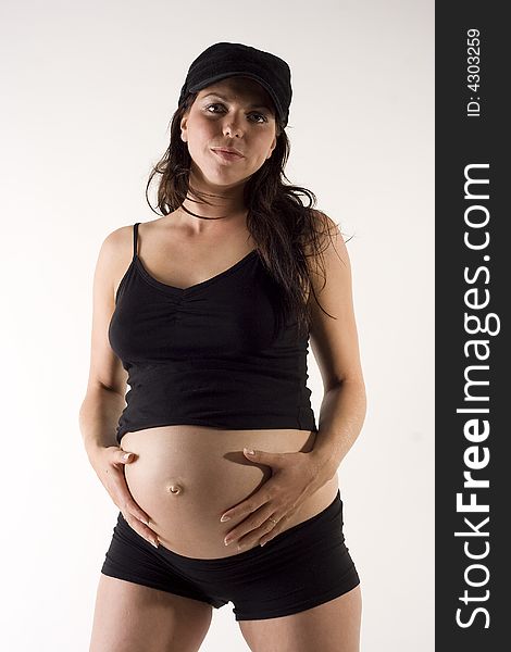 A tough pregnant woman posing