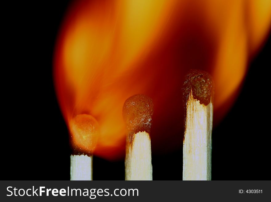 Match with smoke isolated in dark background