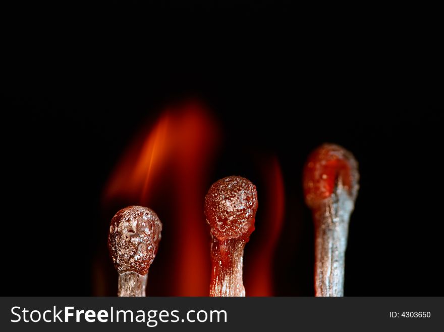 Match with smoke isolated in dark background