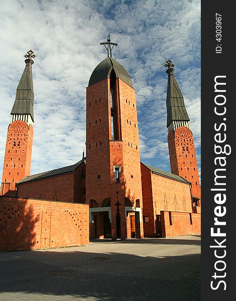 Red church and cirrus sky