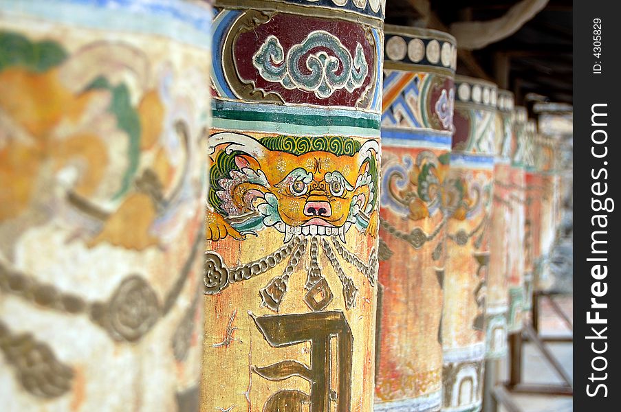 Tibetan Buddhist rolling pole with colorful icon. Tibetan Buddhist rolling pole with colorful icon