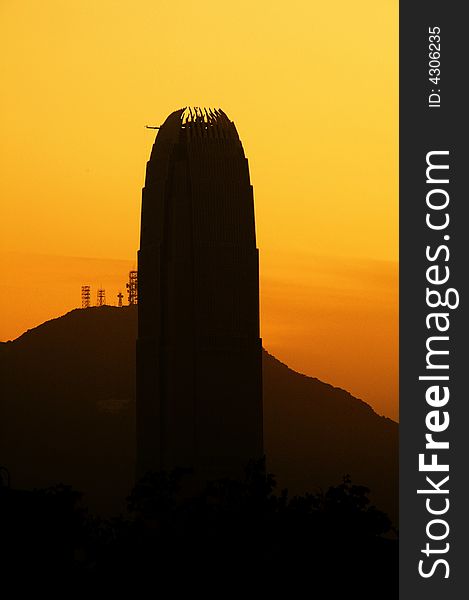 Silhouette of a tall tower that is under construction. Behind are the hills. Can symbolize outstanding results. Silhouette of a tall tower that is under construction. Behind are the hills. Can symbolize outstanding results.