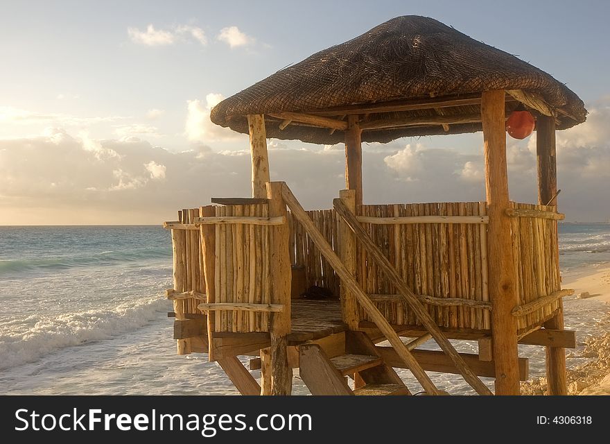 A bamboo and straw lifeguard hut on the beach. A bamboo and straw lifeguard hut on the beach