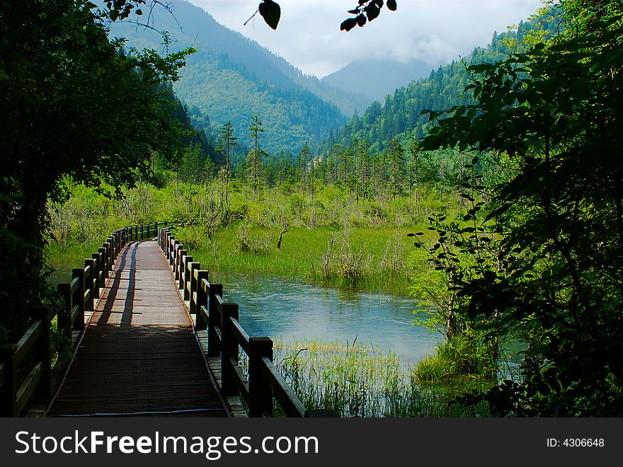 Footbridge in Jiuzaigou nature protection area, Sichuan province, South-West China.